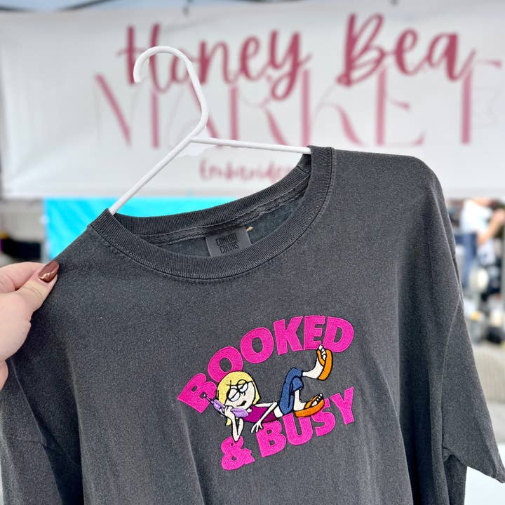 Pepper Booked & Busy T-Shirt for wholesale on Faire0