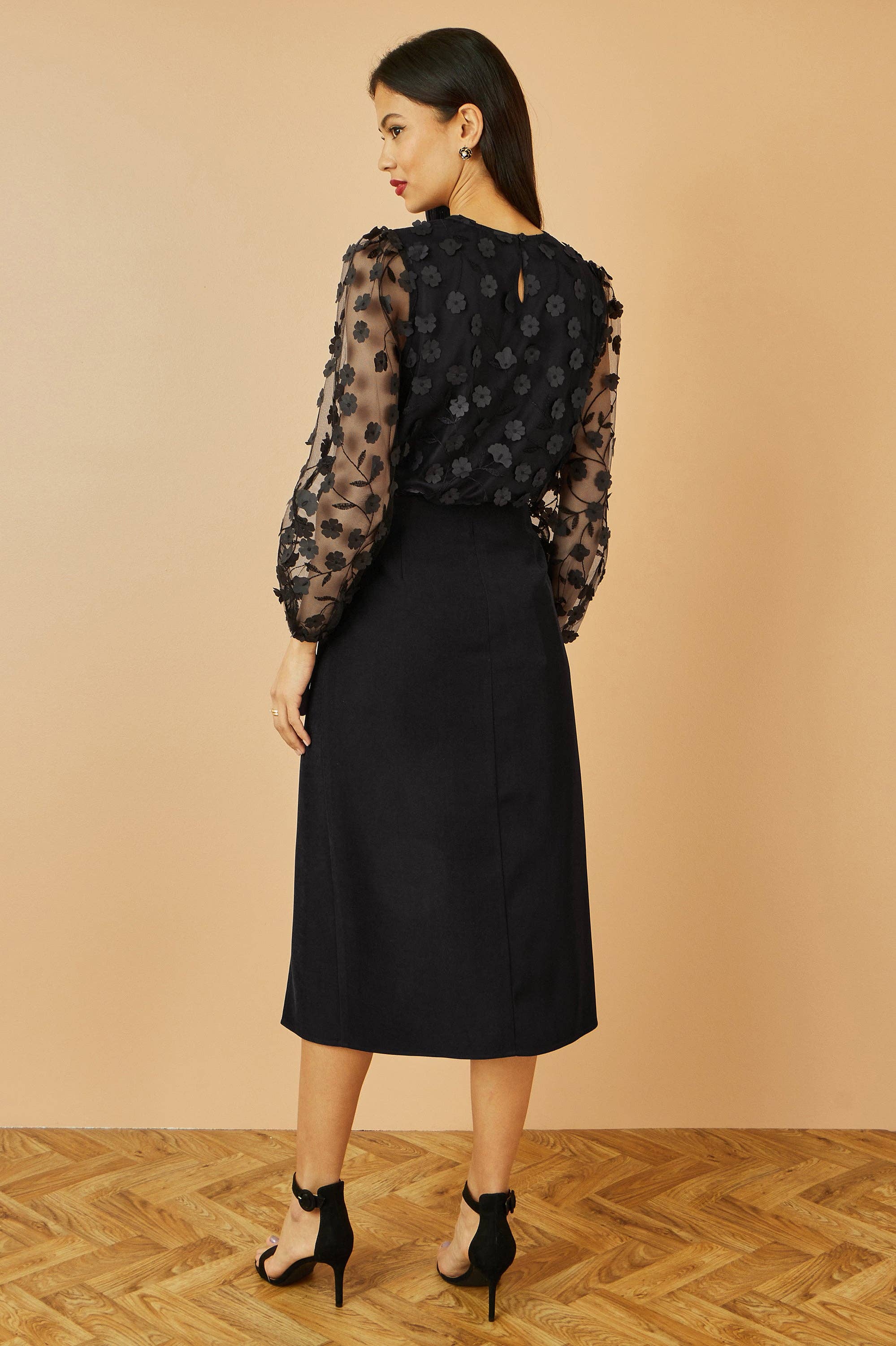 Yumi Black Sheer Sleeve Applique Flower Top for wholesale on Faire