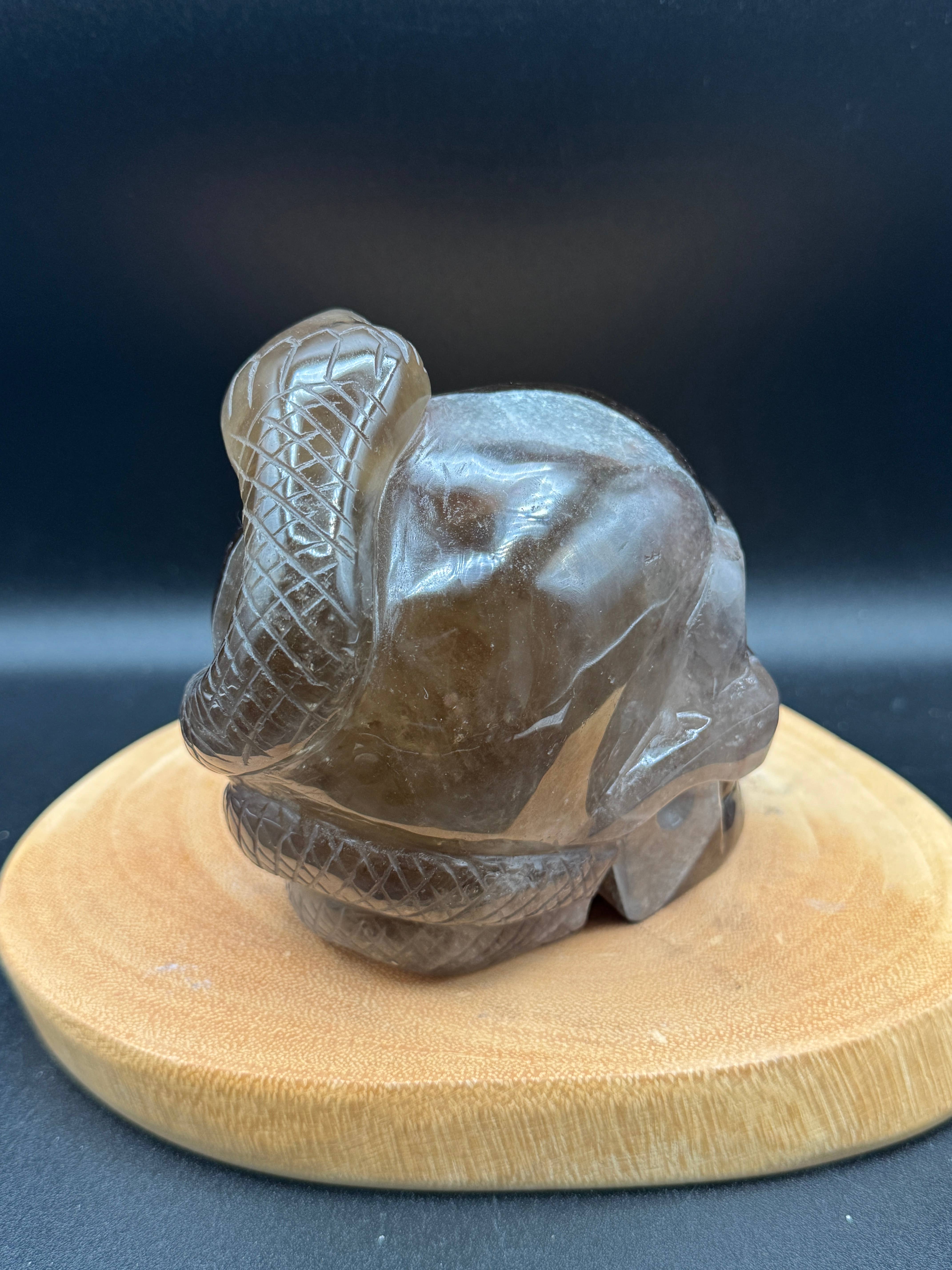 The 7 Directions - Wholesale Spiritual Stone/Crystal - 3.9 lb Unique Smoky skull w/ snake carving H365