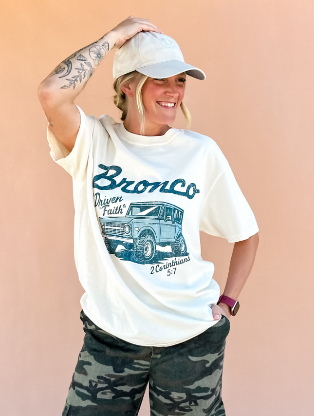 Ivory Driven By Faith Bronco Tee for wholesale on Faire1