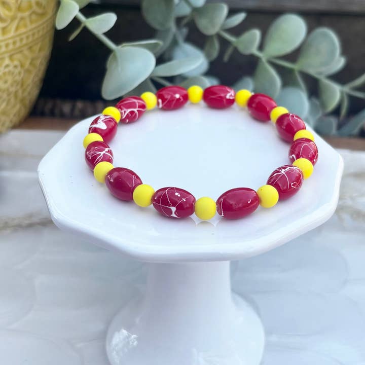 KC Football Bracelets | Splattered Red and Yellow for wholesale by Seasons in Kansas City