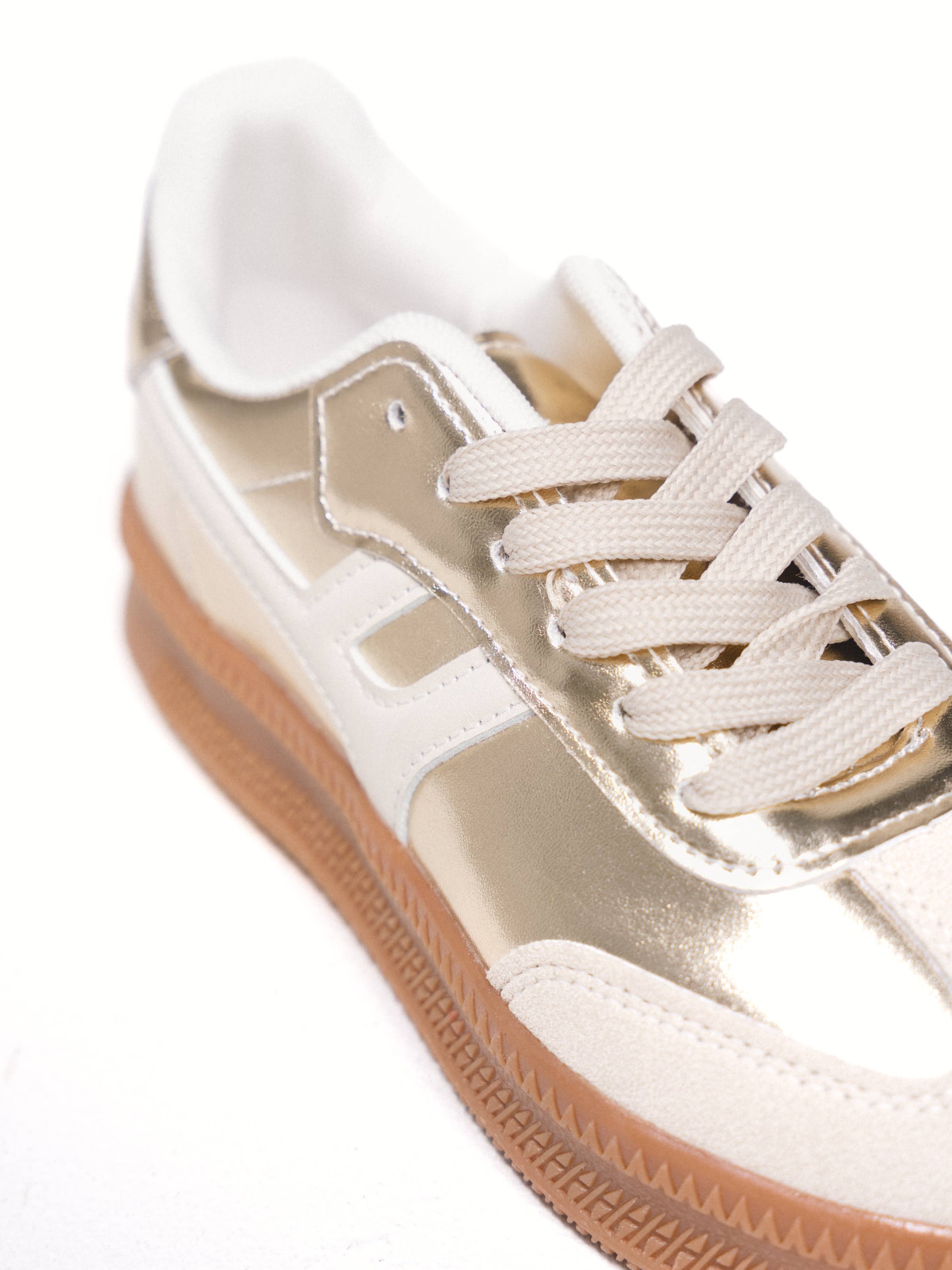 Oro Scarpe da ginnastica metallizzate con suola a contrasto in vendita all'ingrosso su Faire3