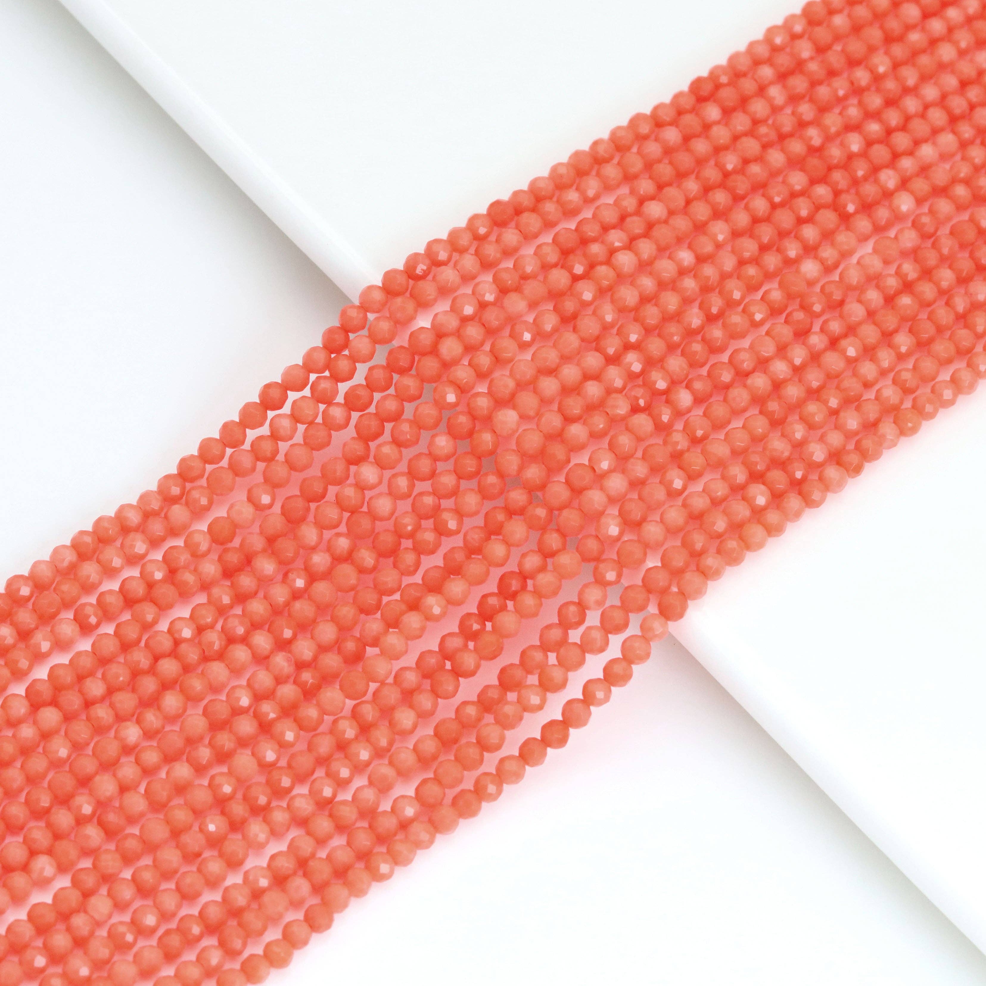 BestBeads&Beyond – wholesale Pärlor – Orange korall runda fasetterade pärlor, Sku #U20360