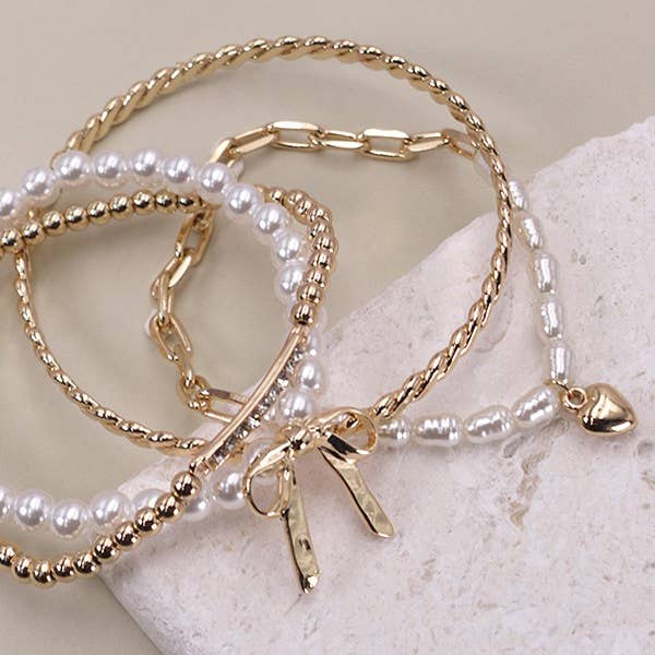 GOLD BOW PEARL RHINESTONE BAR STRETCH BANGLE SET | 80B137 for wholesale on Faire