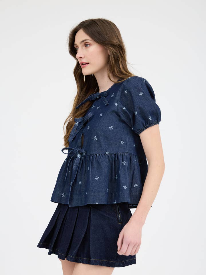 DENIM BOW PRINT PUFF SLEEVE FRONT SELF TIE RUFFLE HEM BLOUSE-BACKO for wholesale on Faire