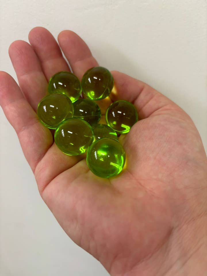 200 x Green Round Bath Pearls - Coconut And Almond Scented for wholesale by Bare Boutique