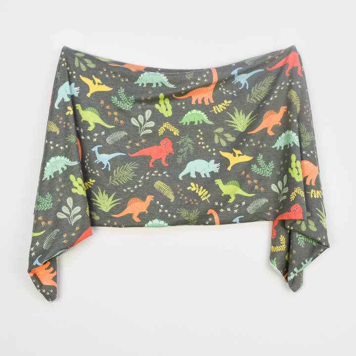 Extra Soft Stretchy Knit Swaddle Blanket: Jurassic Tracks for wholesale by Village Baby