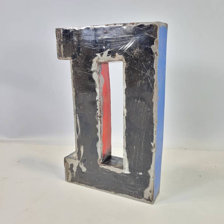 Letter “D” made from recycled oil barrels | 22 or 50 cm | ver for wholesale by Moogoo Creative Africa