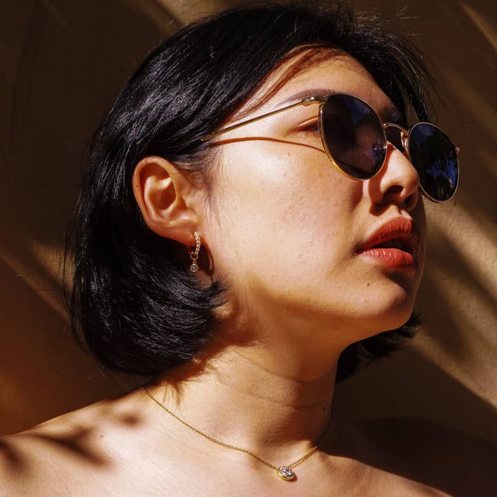 Gold Adelina white earrings for wholesale on Faire2