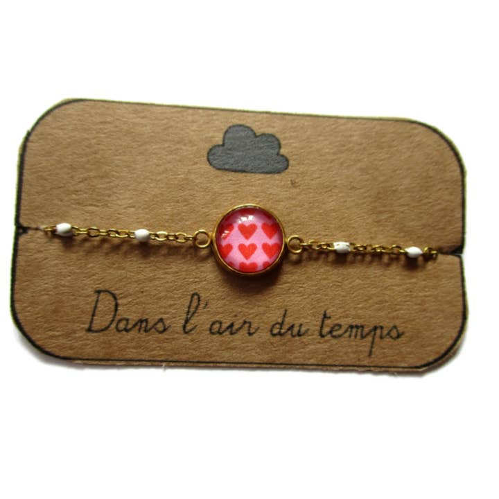 Dans l'Air du Temps Bijoux - Vendita all'ingrosso Braccialetto con ciondolo/pendente - Bracciale Cuore Rosso su sfondo rosa finitura dorata o argentata