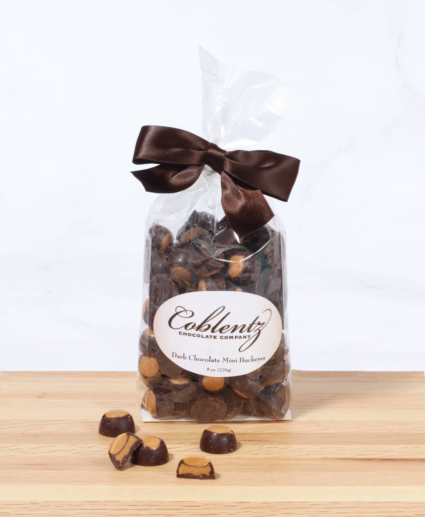 Coblentz Chocolate Company - Wholesale Chocolate Covered Sweets - Dark Mini Buckeyes Bag With Bow