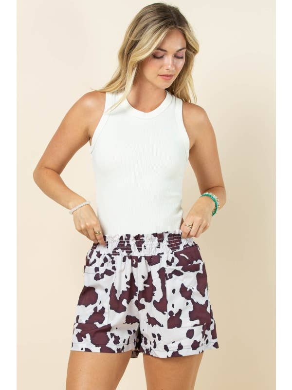 Brown Cream AP1312-MARGOT COW PRINT SMOCK ELASTIC WAIST WOVEN SHORTS for wholesale on Faire