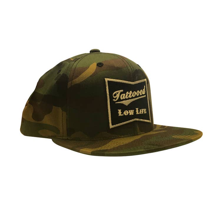 Tattooed Low Life Snap Back Hat Green Camo for wholesale on Faire