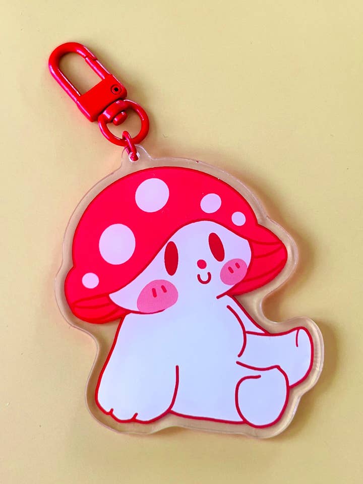 Sitting Marshall sleutelhanger voor wholesale door Mar De Luna Arts Co