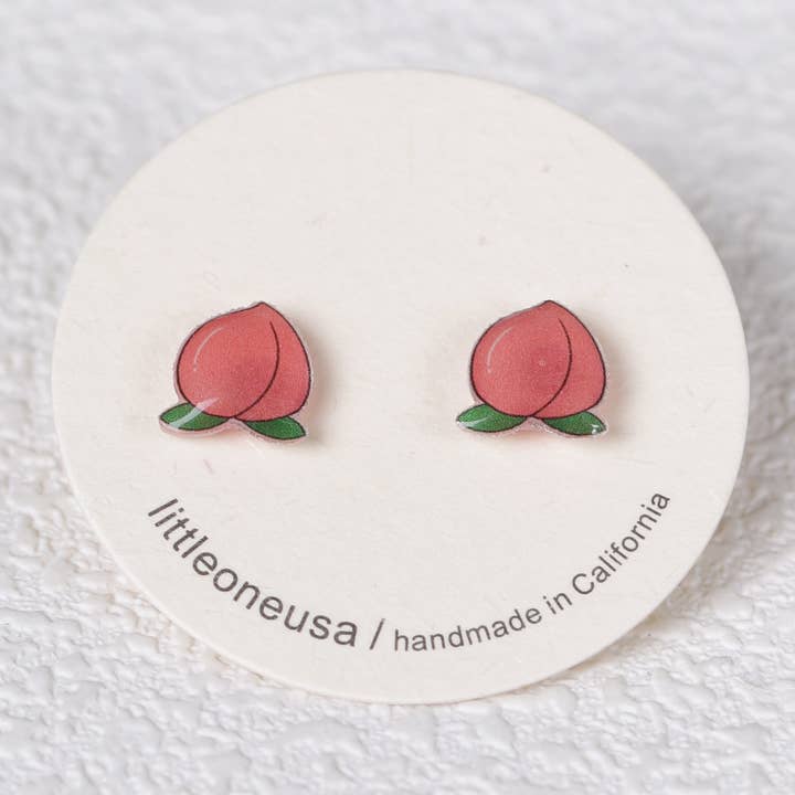 Orecchini a bottone in titanio rosa pesca per la vendita all'ingrosso da parte di littleoneusa