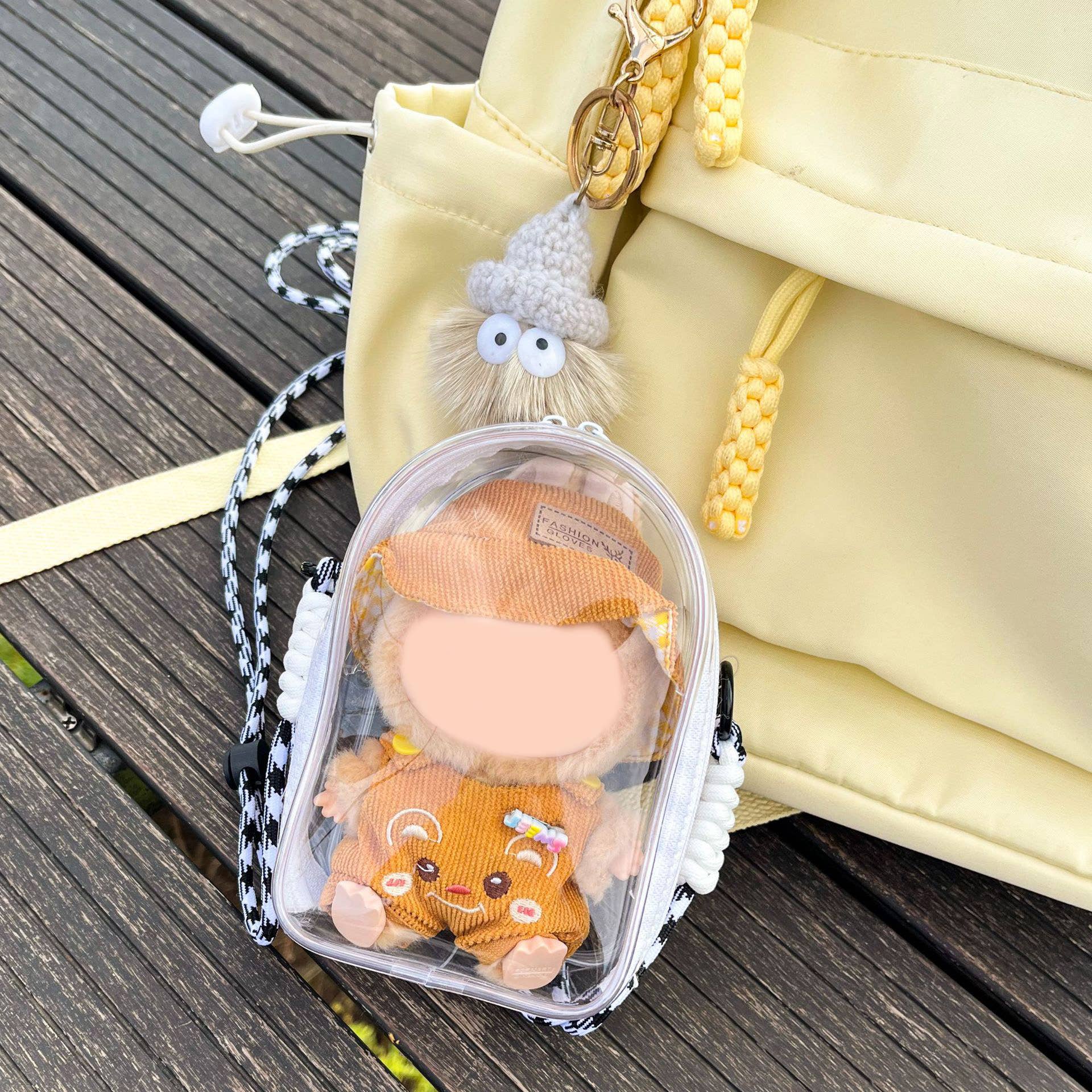 Little Trendy - Vente Accessoire de poupée – enfant - Sac bandoulière transparent de protection en PVC pour poupées de 15 cm2