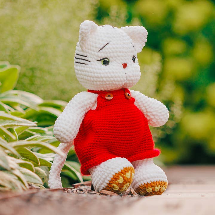 Handmade Crochet White Cat Plushie in Red Overalls,Amigurumi for wholesale by Magnetic Soul