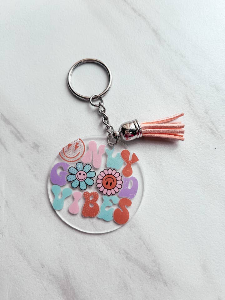 Round Keychain for wholesale by Enchantment Creative, LLC