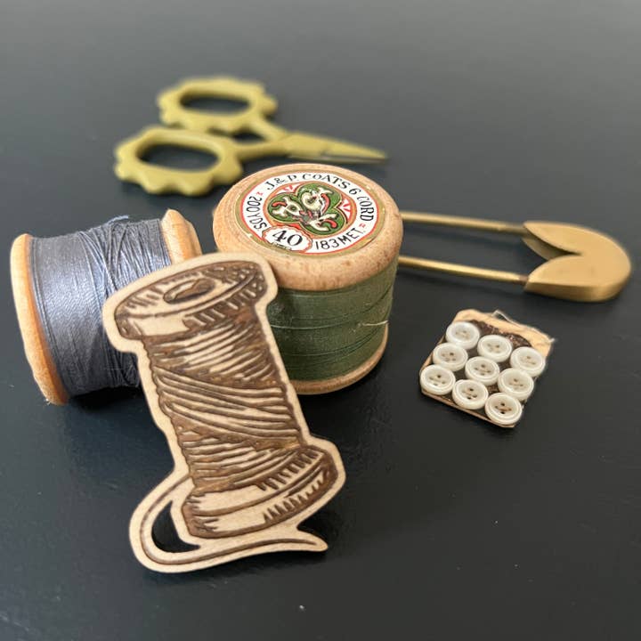 Cotton reel etched wooden brooch for wholesale by Rock & Saltwater