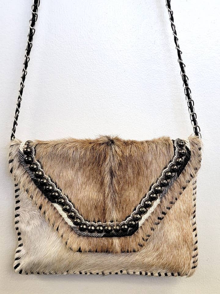 BOHEMIAN HAIRON LEATHER CLUTCH for wholesale by Ricki designs