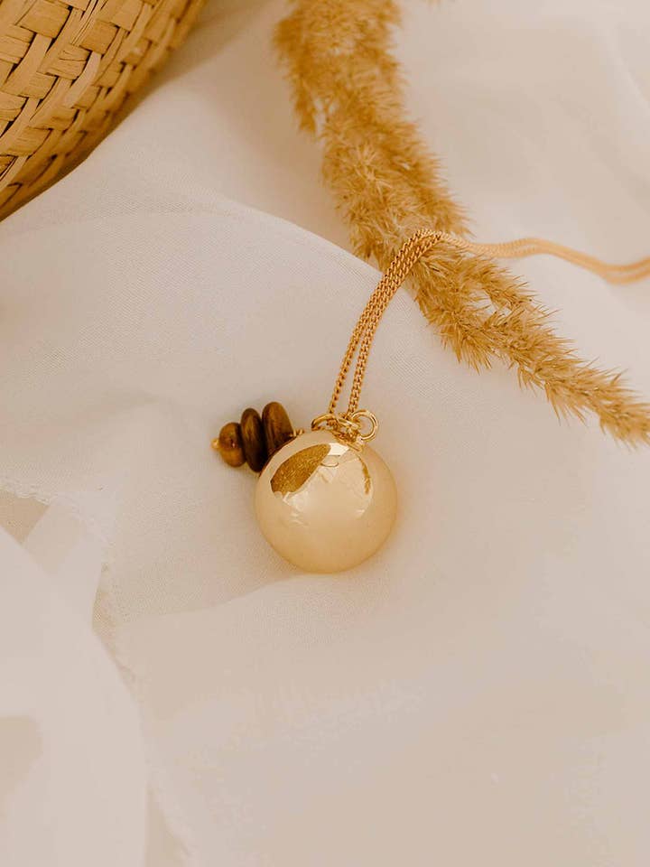 Elsa gold pregnancy ball for wholesale by Atelier Aismée