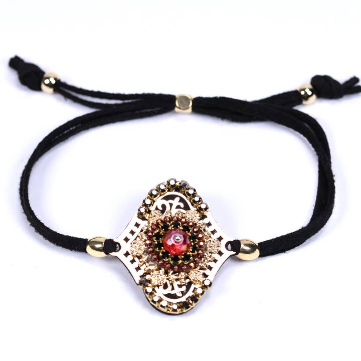 Boho style bracelet with black cord and centre feature for wholesale by Tempest Designs
