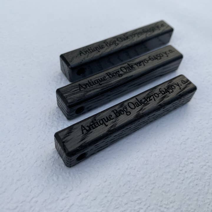 Bog oak keyrings 2 1/3"x3/8"x3/8" made from 6450 y.o. wood for wholesale by Antique Bog Oak