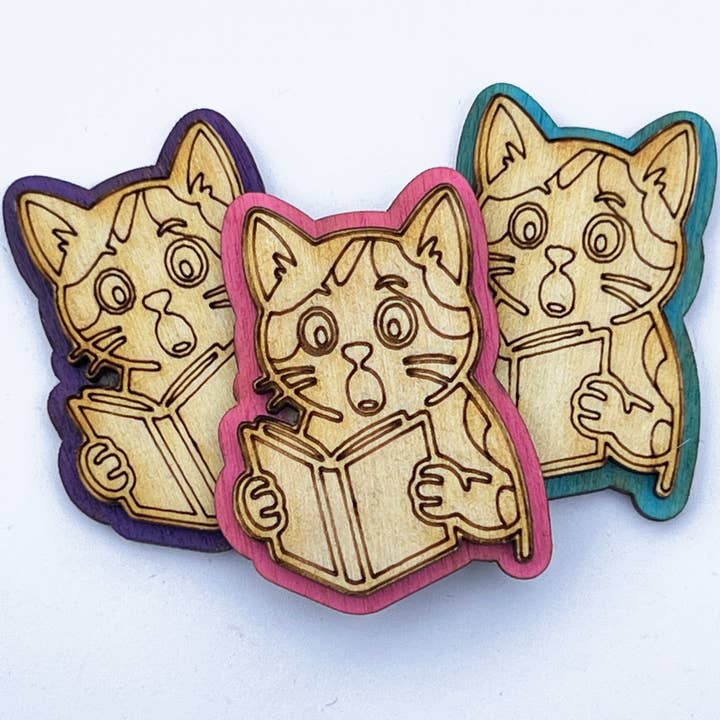 Plot Twist Cat Wooden Pin – Hand Painted 2-Layer Design for wholesale by Squirrel Tacos Papercuts