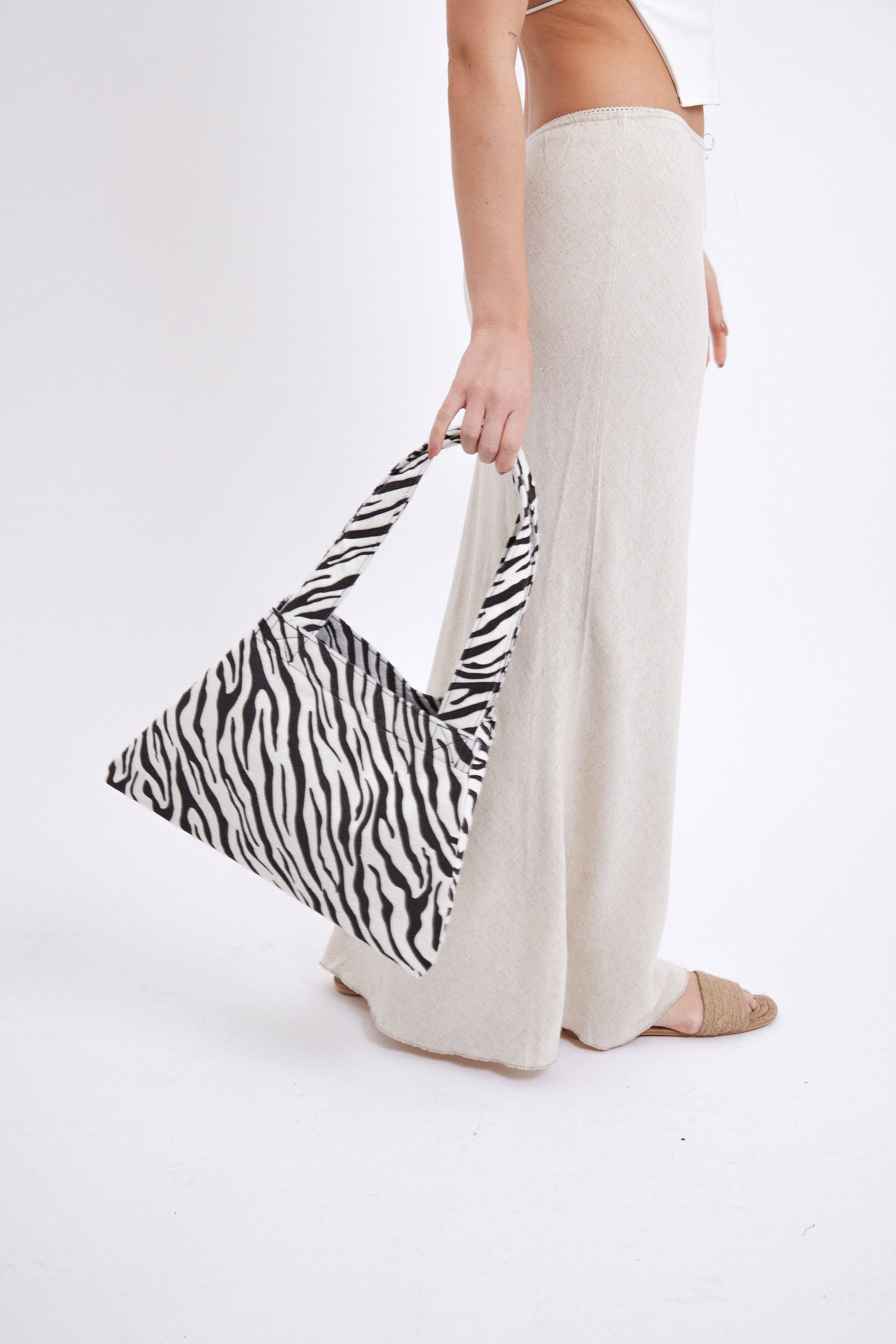 Tapered Pony Skin Shoulder Bag in Zebra Print for wholesale on Faire3