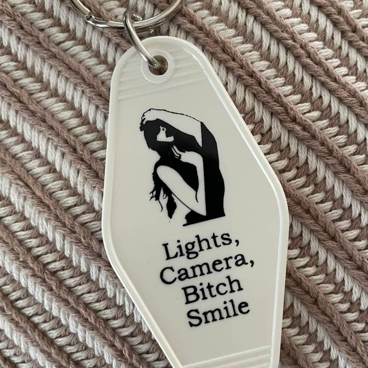 The 3 Sisters Design Co. - Wholesale Keychain - Unisex - Motel Key Fob - Taylor Swift (Lights, Camera, Bitch Smile)