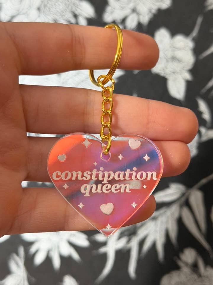 Constipation Queen Iridescent Acrylic Keychain for wholesale by ShlemonArt