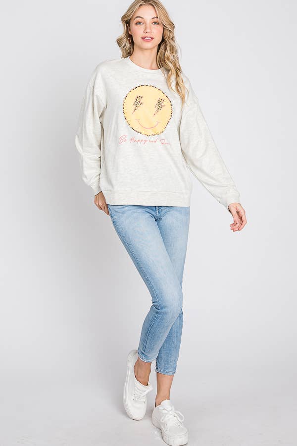 FARINA D'AVENA maglione con grafica «be happy and smile» con faccina felice in vendita all'ingrosso su Faire11