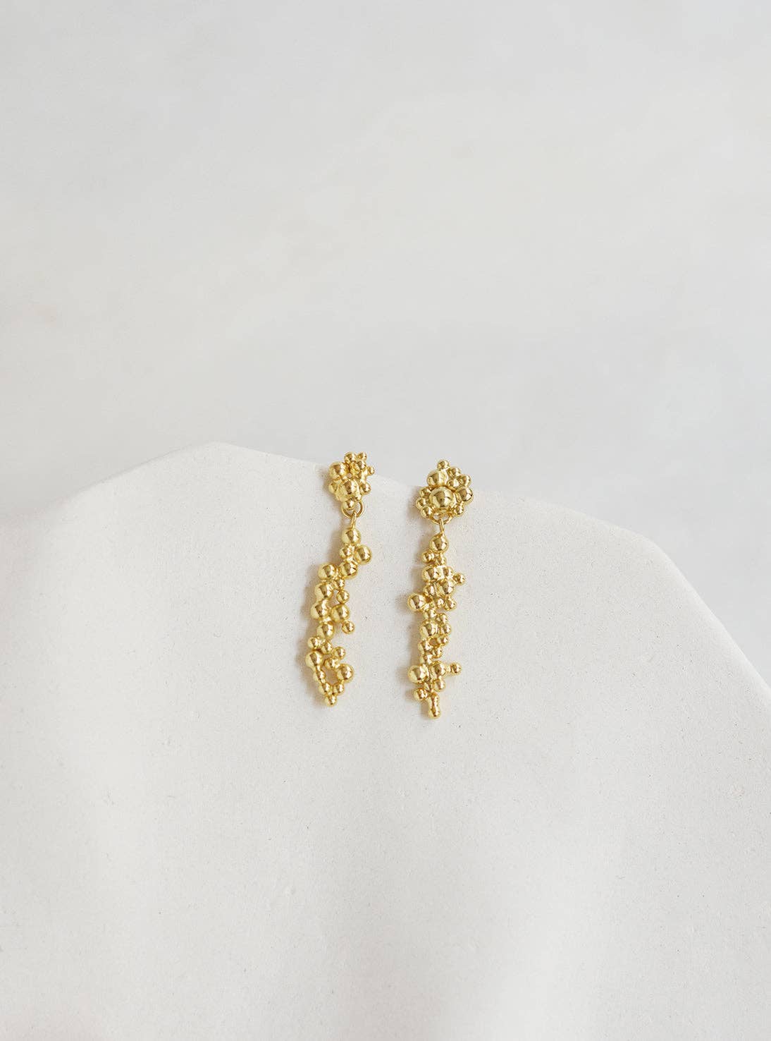Gold Deia earrings for wholesale on Faire2