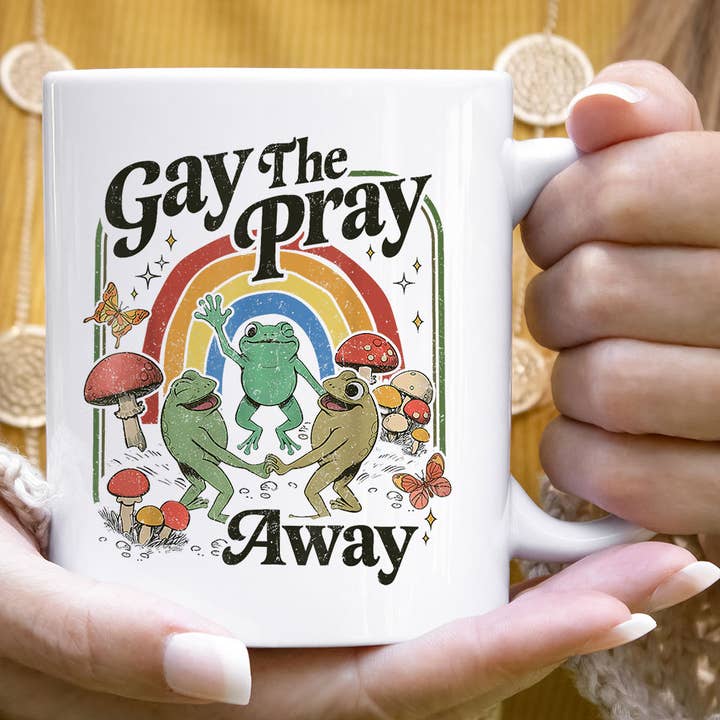 Gay The Pray Away - Funny Retro Cottagecore Pride Coffee Mug for wholesale by House Of Rodan