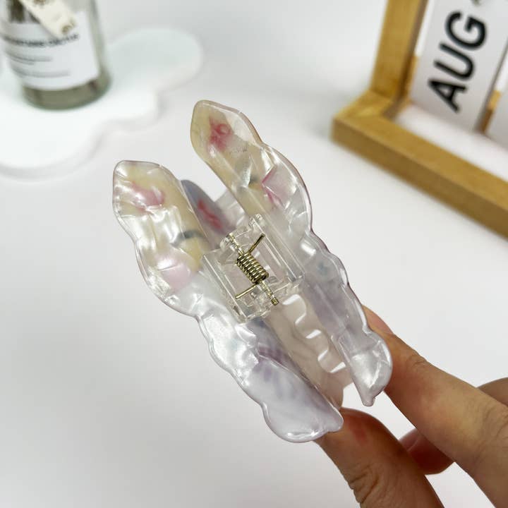 White Japanese Lucky Cat Acrylic Hair Clip for wholesale on Faire