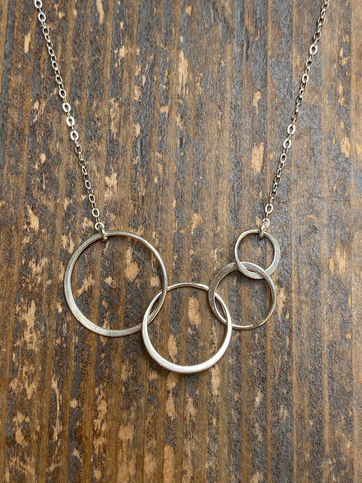 Gold infinity four circle necklace for wholesale by Rose Burkhardt Jewelry