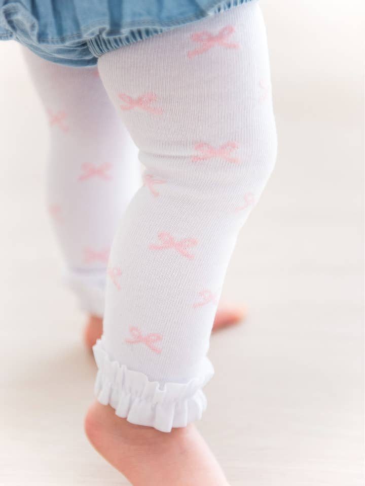 Leotardos sin pies con volantes y estampado de lazos rosas para niñas para venta al por mayor de RuffleButts + RuggedButts