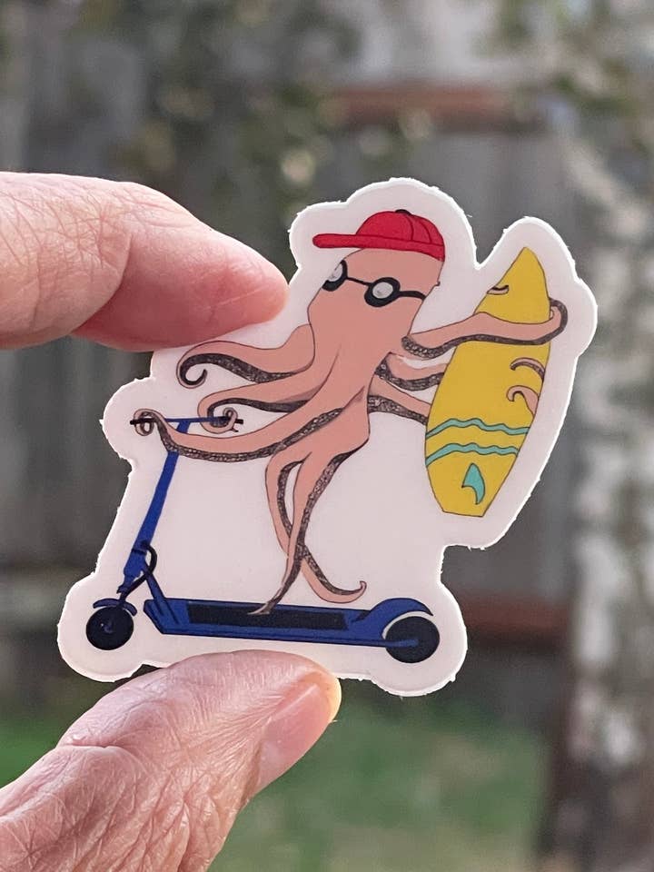 Octopus Riding Scooter with Surfboard Vinyl Sticker - Beach Commute Decal for Surfers & Scooter Riders for wholesale by Color Crumbs Club