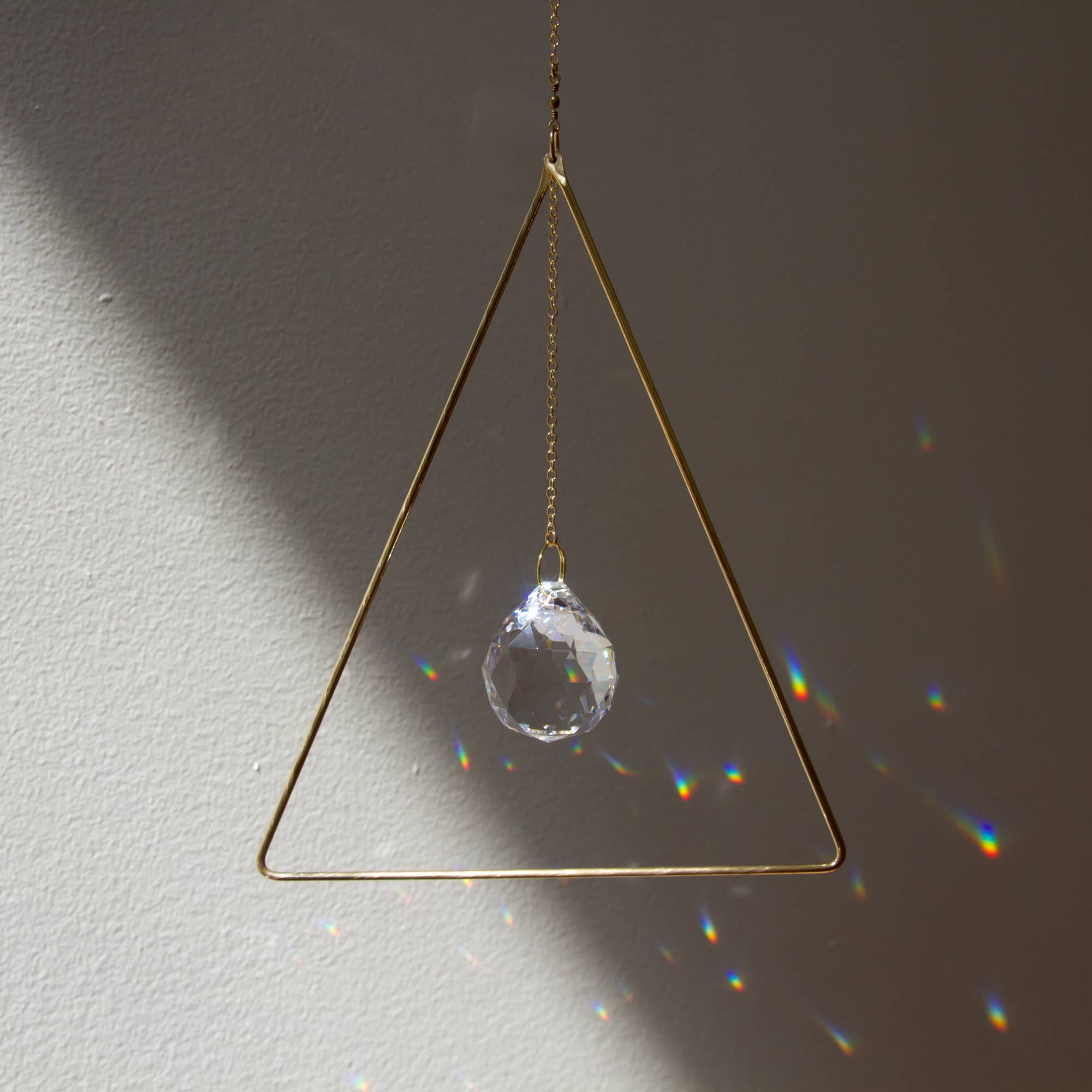 Sol Proaño - Wholesale Suncatcher - Prisma 21 Triangle Brass Suncatcher2