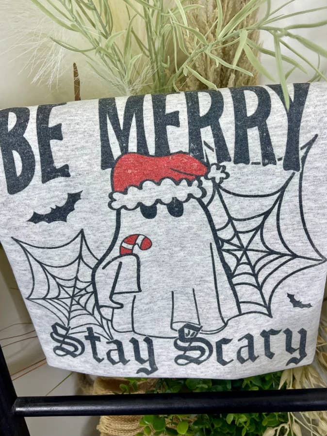 Be Merry Stay Scary (Gildan Tee) for wholesale by 1/2 Penny Wholesale