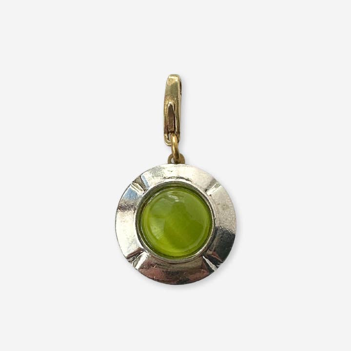 Vintage silver round charm with lime green center stone for wholesale by Lulu’s Petals
