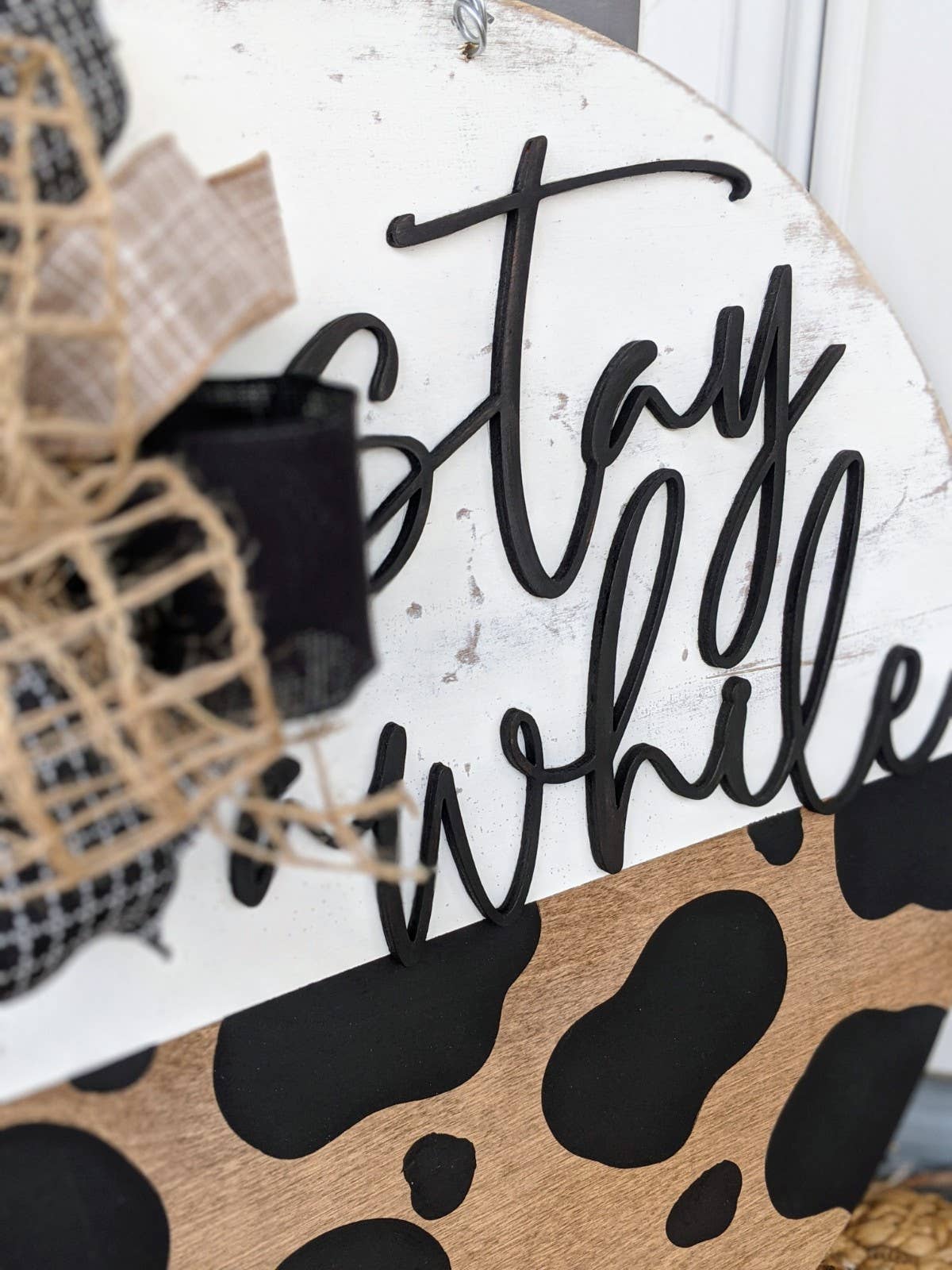 Pocketful of Posies - Wholesale Door Hanger - Stay Awhile Cow Print Door Hanger1