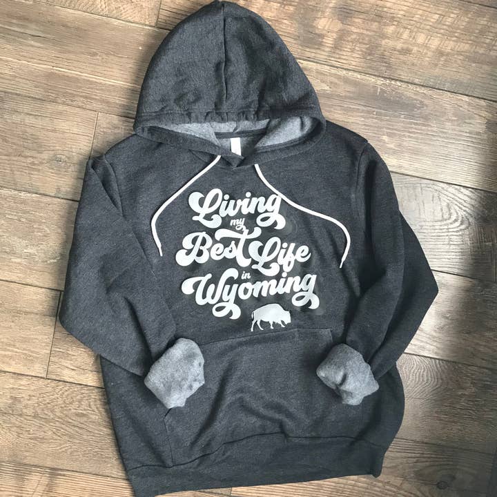 Living My Best Life in Wyoming Retro Hooded Sweatshirt in Dark Grey Heather for wholesale by Living My Best Life in Wyoming