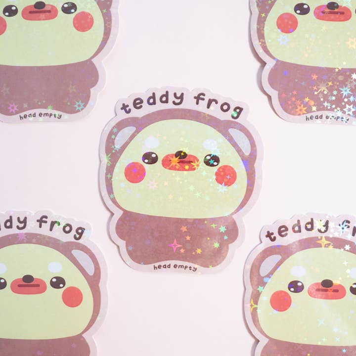Autocollant Holo en vinyle avec tête de grenouille en peluche vide pour la vente par Notmehmehstudio