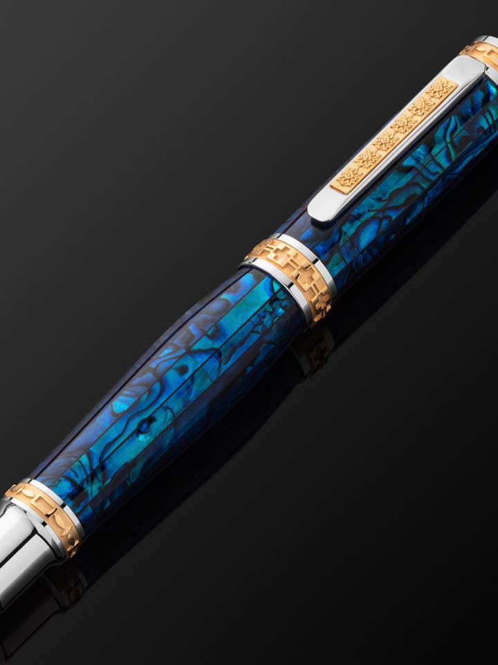 PITCHMAN CLOSER™ ROLLERBALL PEN - Handcrafted of Sapphire colored Pāua Abalone Shell, 22 Kt Gold, and Rhodium - Limited Production for wholesale by Pitchman®