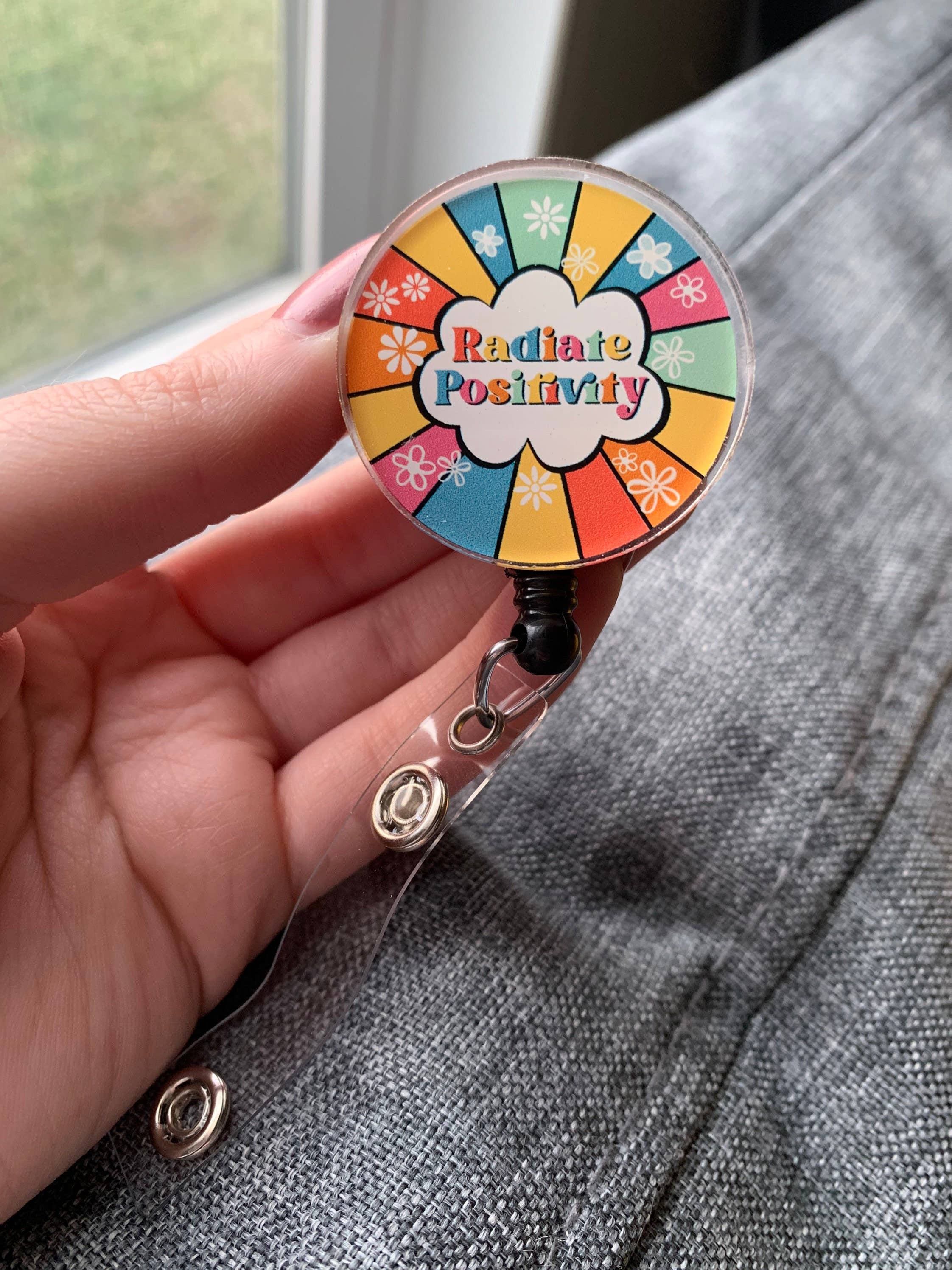 Wholesale Radiate Positivity Badge Reel  Cute Badge Reel for your store -  Faire