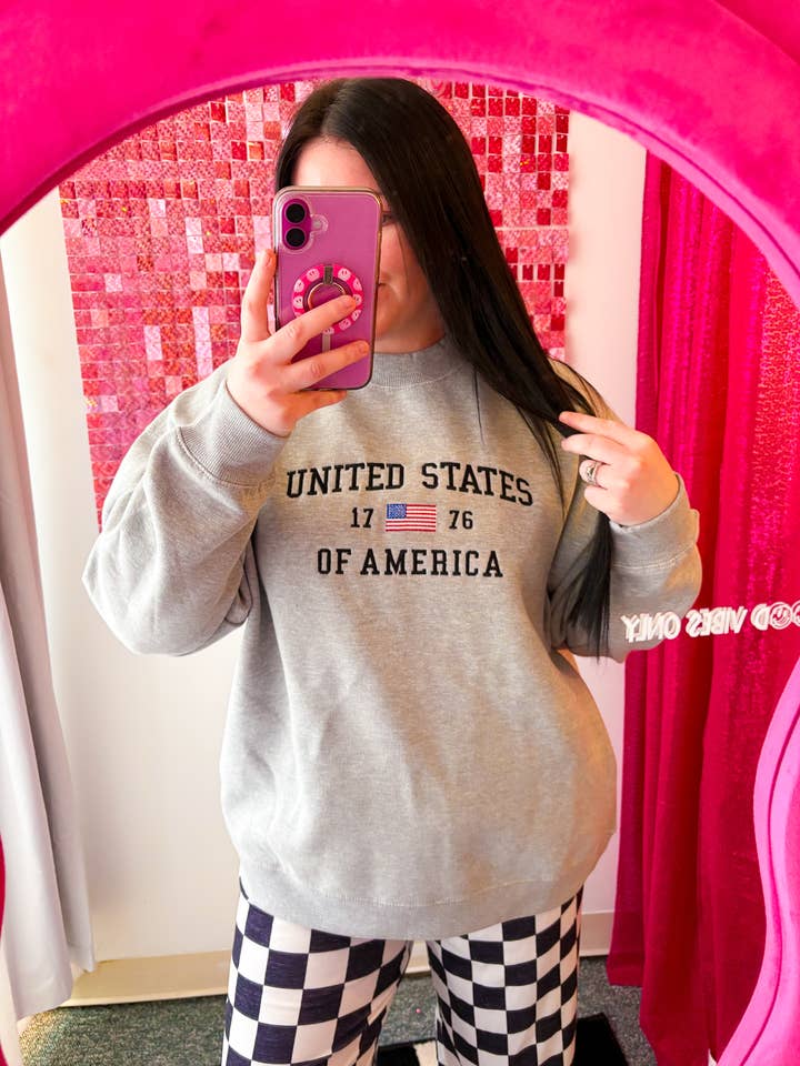 Courtesy of the Red, White & Blue Oversized Crew for wholesale by Graphic Tees & Co.