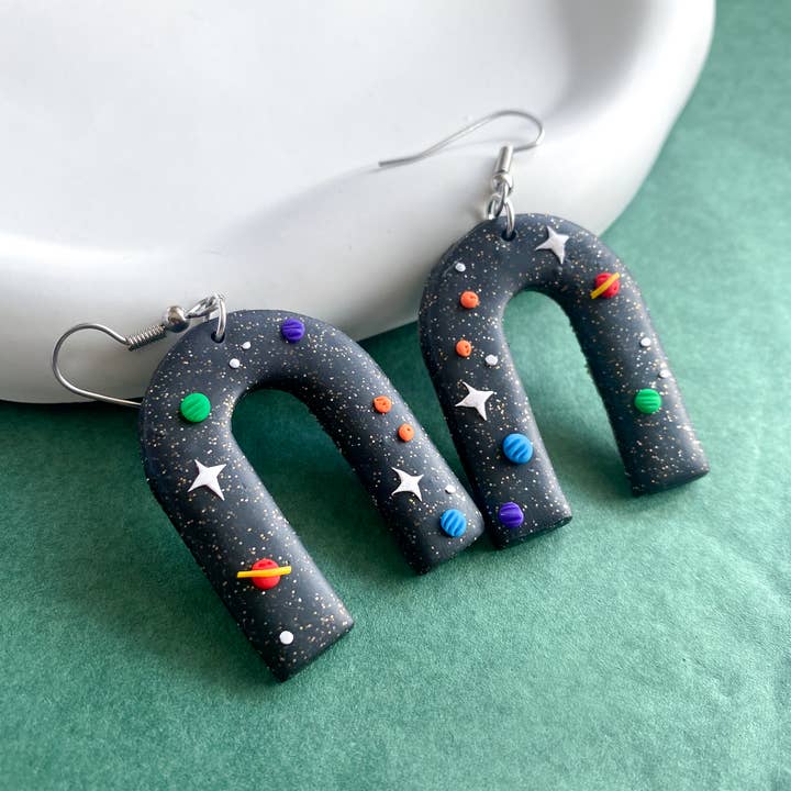 Space Arches / Clay Stars Planet Earrings for wholesale by Peripheral US