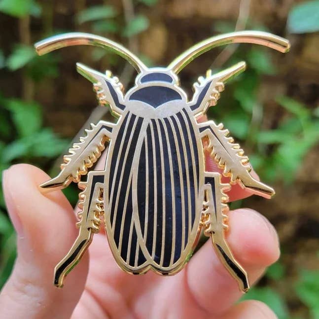 Golden Roach Enamel Pin for wholesale by Defensive Wounds