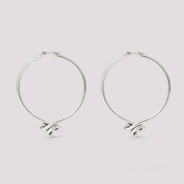 Big Swoop Hoops for wholesale by Suna Bonometti LLC